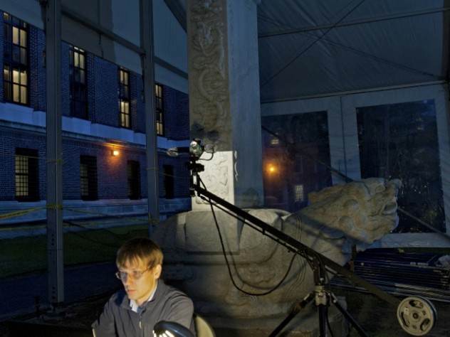 The Peabody Museum's Alexandre A. Tokovinine, a lecturer on anthropology and research associate, is shown at work within a protective tent during the scanning of the Chinese stele—conducted at night for optimal results. 