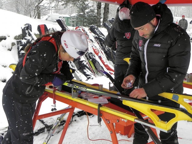 Photograph courtesy of Harvard Skiing Harvard’s Nordic ski team head coach Chris City tests waxes with racer Alena Tofte ’13 before the Dartmouth Carnival in Craftsbury, Vermont, last winter.