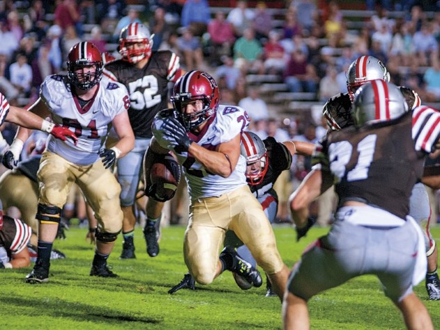 Photograph by Robert Worley Ever in the Brown backfield, Scott Peters (44) and Connor Sheehan (50) headed a hard-hitting crew that limited the Bears to 88 yards on the ground.