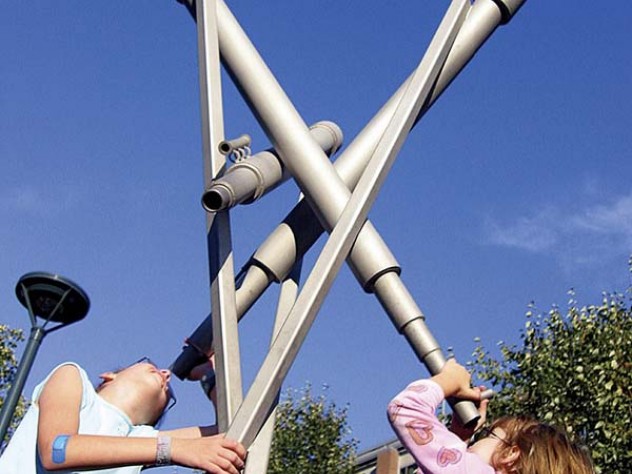 Photograph courtesy of Ross Miller One of Miller's surprises: model telescopes in University Park Common near MIT