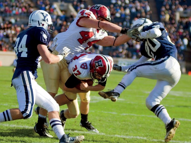 The Murphy effect: Having eschewed an easy field goal, Harvard placekicker David Mothander (37) carried out the fake called by his coach and crashed over the goal line for a momentum-building touchdown against Yale in 2011.