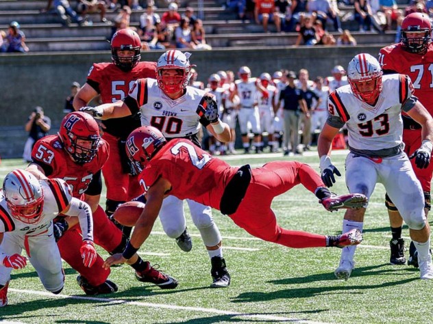 Capping a 98-yard drive, sophomore back Lavance Northington (2) dove into the end zone for the Crimson’s third touchdown against Brown.