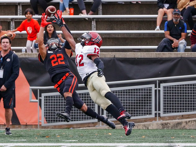 Princeton wide receiver Dylan Classi outstretches for a catch over Harvard defensive back Isaiah Wingfield.
