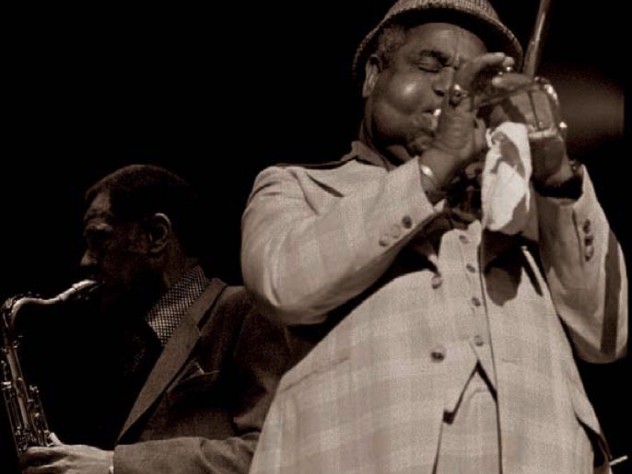 Photograph of jazz greats Dizzy Gillespie and Dexter Gordon, circa 1976. Photograph of jazz greats Dizzy Gillespie on trumpet and Dexter Gordon on tenor saxophone, circa 1976