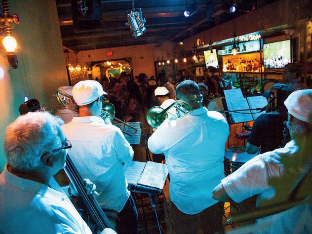 Musicians play Latin jazz in the front lounge.