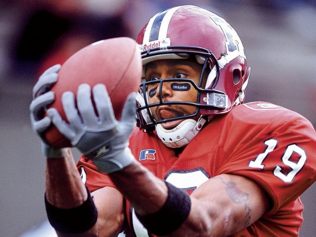 Carl Morris makes a catch. A Harvard player catches a ball at eye level.
