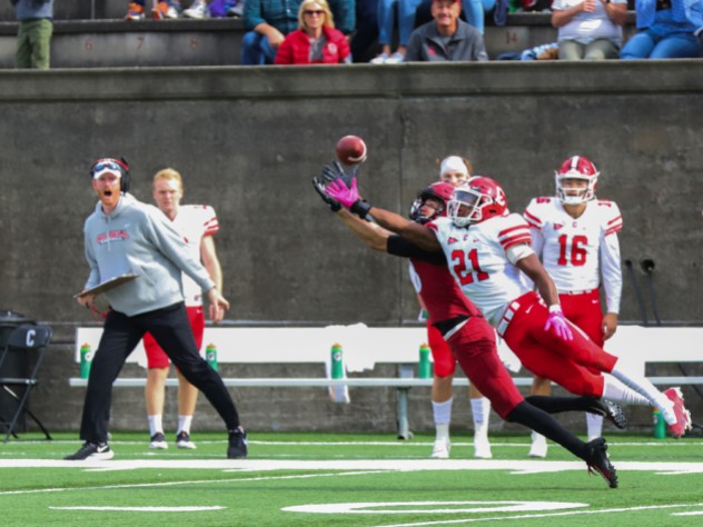 Tightly defended by Cornell's Kenan Clarke, Harvard senior wideout James Batch just fails to make the catch.
