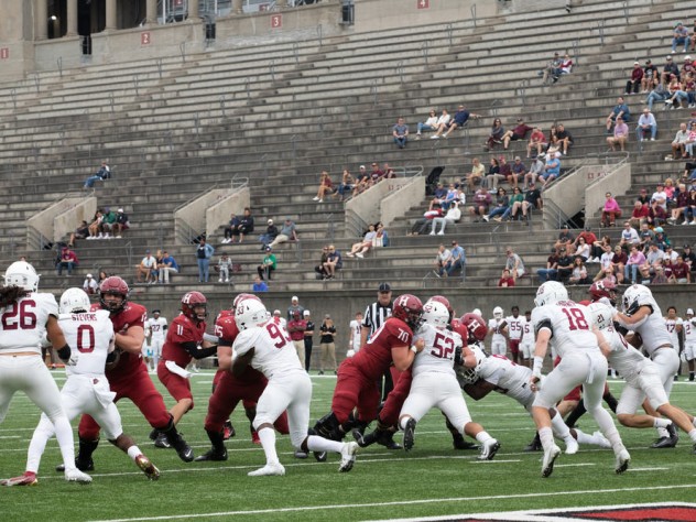 The Harvard offensive line battles with the Lafayette defensive line.