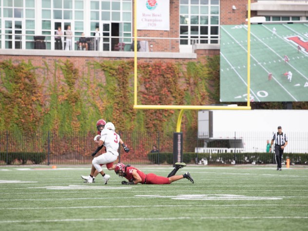 Two Harvard defenders pursue a Lafayette wide receiver.