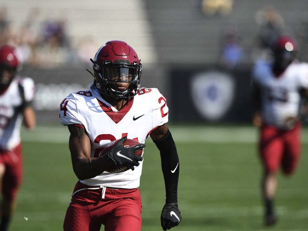 Khalil Dawsey runs downfield with the football.