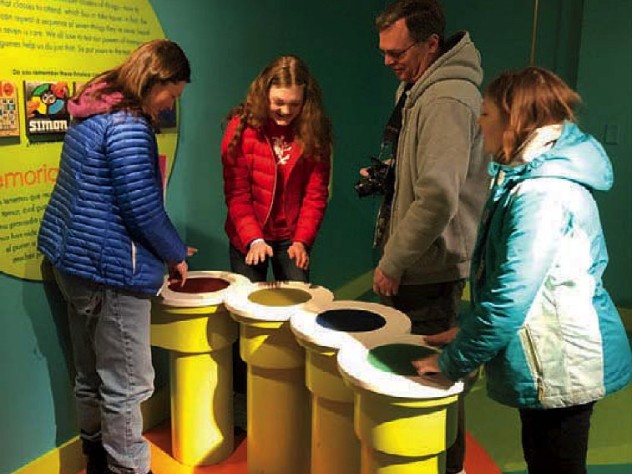Family and friends enjoying interactive games at the Springfield Museums