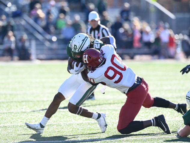 Harvard player Truman Jones defends agents Dartmouth runner Q Jones.