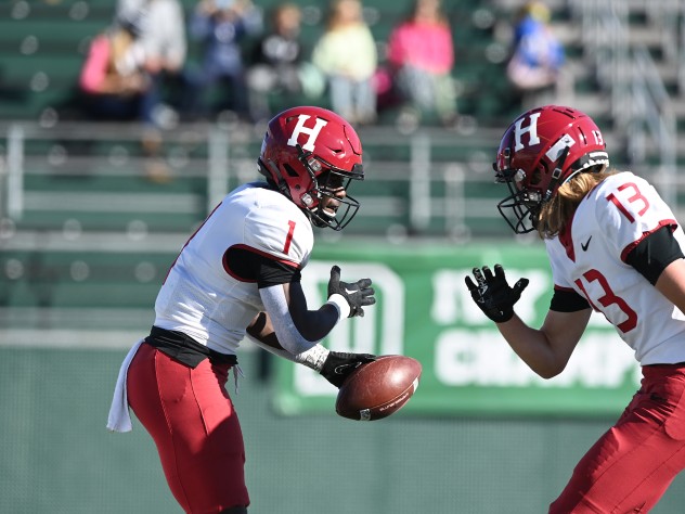 Harvard receivers Kym Wimberly and Ledger Hatch hold a choreographed end-zone celebration after Wimberly's second-quarter run for a score.