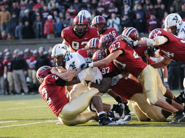 Photograph by Meredith Keffer Halfback Alex Thomas was Yale’s heavy-duty rusher, carrying 23 times for 71 yards and three short-yardage touchdowns. On Yale’s last drive of the game, he was run down by a Harvard posse led by strong safety Jonathan Mason ’12 (2), end Chuks Obi ’11 (97), and free safety and captain Collin Zych ’11 (27).