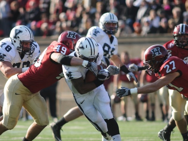 Photograph by Meredith Keffer Linebacker Alex Gedeon ’12, who will captain the 2011 squad, was credited with seven solo tackles and 10 assists against Yale. Above: with Collin Zych closing in, Gedeon (49) stops halfback Cargill after a first-half gain of four yards.
