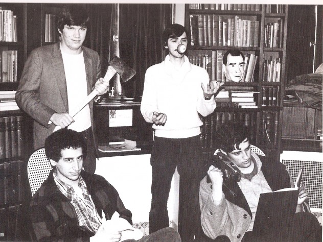 Courtesy of MIke Reiss A 1981 photograph taken in the Lampoon Castle shows <i>Simpsons</i> stalwarts Mike Reiss ’81 (seated left) and Al Jean ’81 (holding an iron). Patric Verrone ’81, who juggles pool balls behind them, is also a successful TV comedy writer with <i>Simpsons</i> credits. Holding the axe is the late Ted Phillips ’81, who became a lawyer in South Carolina and passed away in 2005. He has a character (Duke Phillips) named after him in <i>The Critic,</i> an animated series created by Jean and Reiss.