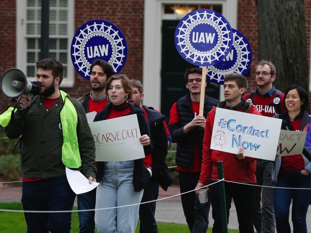 Union protesters march at Harvard University in Cambridge, Mass., Wednesday, May 1, 2019.