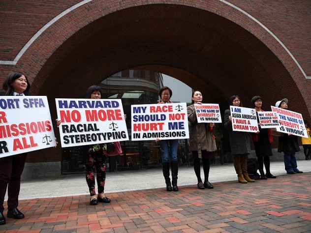 Photograph of demonstrators in front of the federal courthouse in Boston where the SFFA v. Harvard trial took place, with signs reading "Harvard No More Racial Stereotyping" and "My Race Should Not Hurt Me In Admissions.