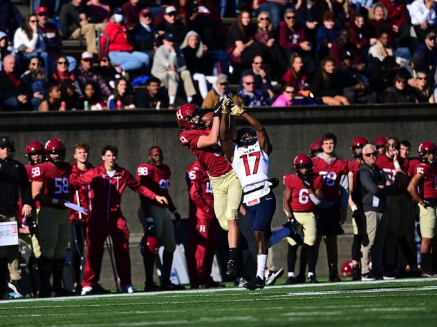 Harvard receiver Ledger Hatch catches the ball over Penn's Jason McCleod.