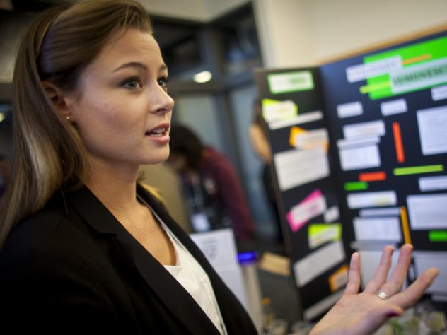 Justin Ide/Harvard News Office Katherine Caputo ’12 explains her project at the fair where students in the course presented their final projects.