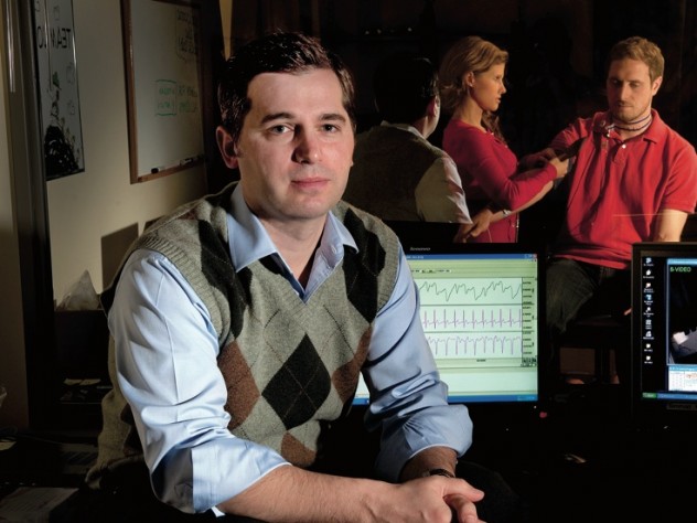 Matthew Nock sits in his lab’s control room, where researchers record subjects’ behavioral and physiological responses during experiments. For example, they might measure whether people who engage in self-injury show greater emotional distress, in response to frustrating tasks, than people who do not. (Nock’s lab manager and a postdoctoral fellow are seen in the adjoining room through one-way glass.)