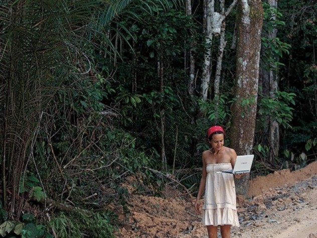 Photograph by Jake Bryant/www.envirofoto.com Lissandra Souza at Ducke—even without Internet access, computers are vital field-research tools.