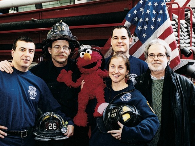 Courtesy of John Weidman Four New York firefighters with John Weidman and <i>Sesame Street</i> character Elmo in 2001.