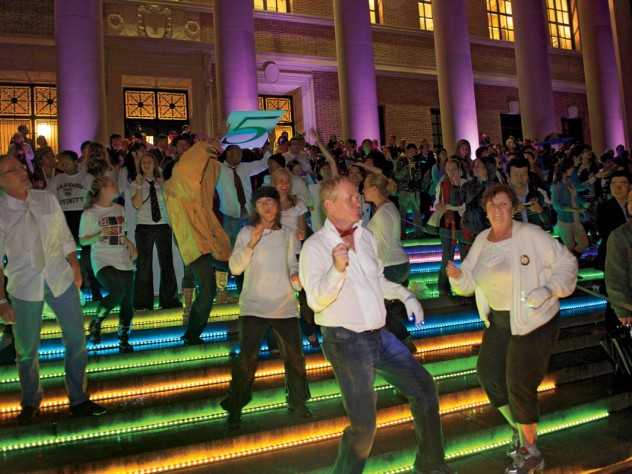Photograph by Jim Harrison Kicking up their heels: a “flash mob” started off the evening’s dancing with a choreographed routine to the tune of James Brown’s “Papa’s Got a Brand New Bag.”