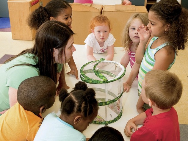Photograph by Stu Rosner In Dorchester, at the Boys & Girls Club, kindergarten-age children play with teacher Melissa Ryan.