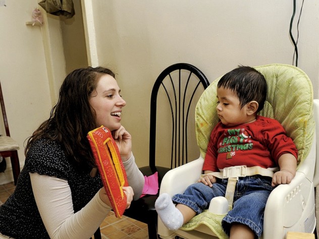  they recognize that professional and personal fulfillment supports maternal mental health. During the same visit, social worker Sarah McLanahan plays with Miguel.