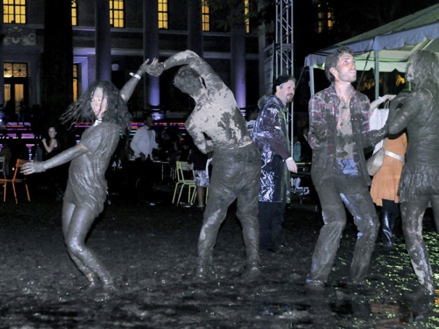 While most revelers fought to keep their feet dry, some embraced the mud.