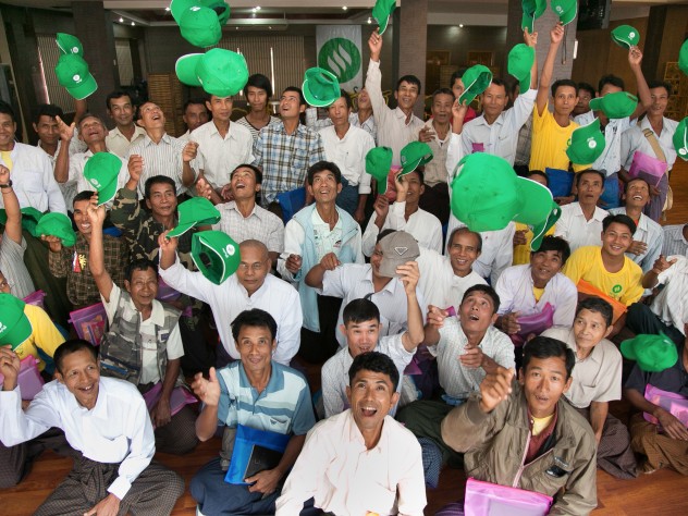 Photograph © Tim Mitzman for Proximity Designs 2013 Rural agents come to Yangon for product and sales training during the monsoon season. For some of the agents, shown here at the 2013 training session, the visit to Yangon is their first immersion in city life.