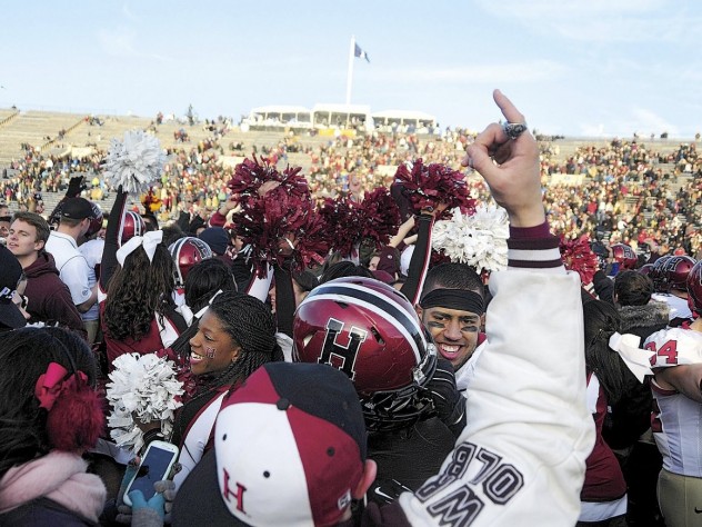 Photographs by Robert Worley Harvard followers stormed the field at Yale Bowl to join players celebrating the Crimson’s seventh straight victory over the Blue.