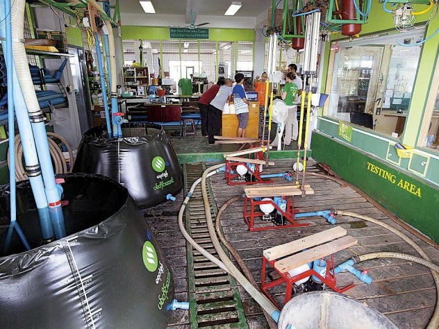 Photograph © Tim Mitzman for Proximity Designs 2013, unless otherwise noted Testing Proximity Designs’ pumps and water baskets at its Yangon factory.