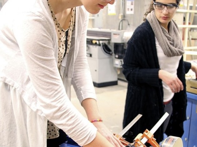 Katherine Ingersoll &rsquo;15 and Samia Kayyali &rsquo;15 work on the construction lab&rsquo;s final project in the GSD&rsquo;s wood shop.