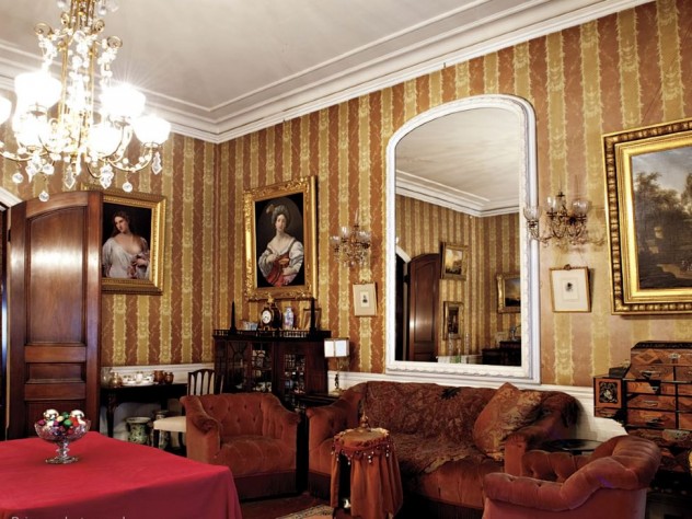 The music room, a family gathering spot, holds many treasures, including the Japanese apothecary chest and a lithophane lamp from Germany.