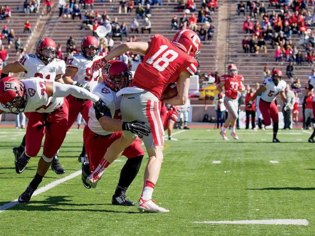 Senior linebacker Jake Lindsey (51) wrapped up Cornell receiver Ben Rogers after a nine-yard gain on this play. The Crimson limited the Big Red to 112 yards through the air in its 40-3 win.