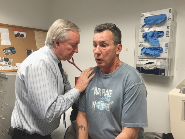 Jim O’Connell checks longtime patient Joe Meuse.