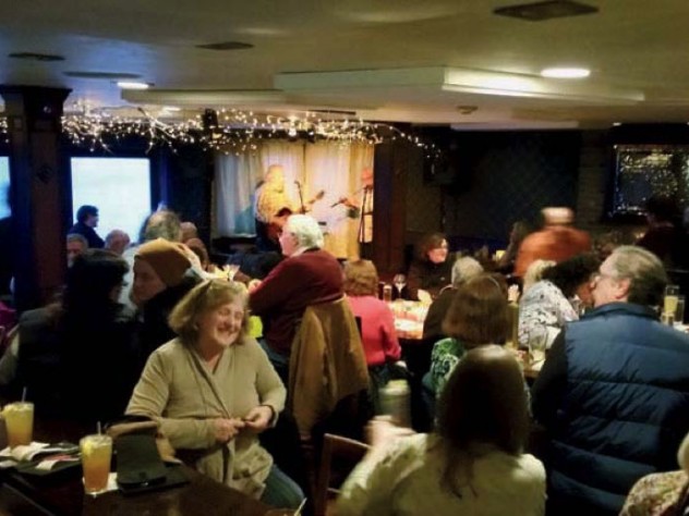Dining room at the Mews restaurant with local singers performing
