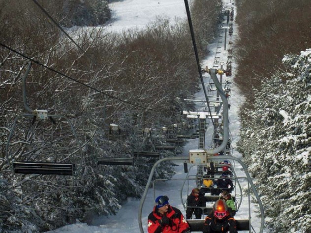 Chair lift carrying skiers to 45 trails