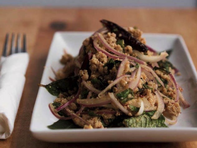 An appetizer of ground pork with onions and basil