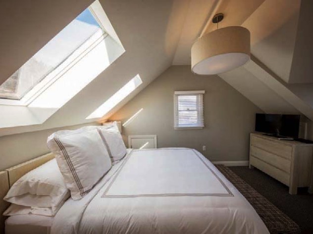 Sunlight flows into a Warfield House Inn bedroom