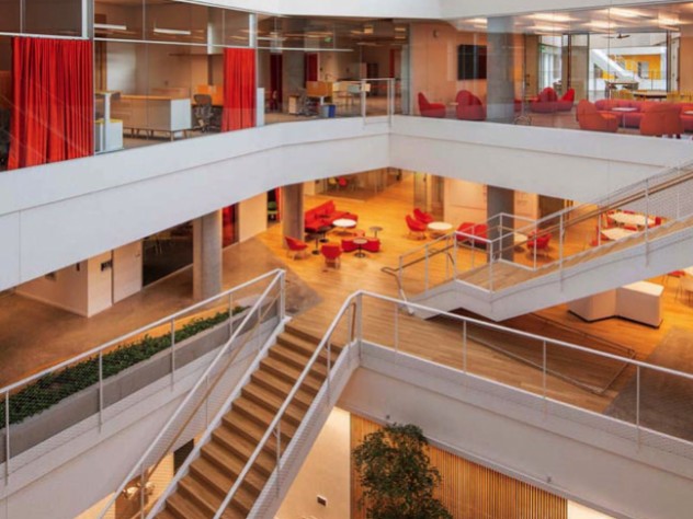 A second, smaller atrium includes a graduate-student lounge, a glassed-in level with red furniture.