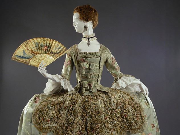 Ornate eighteenth-century dress with wide hooped skirt