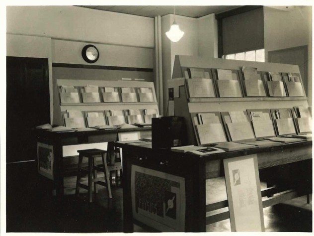 An historic photograph from Radcliffe’s Schlesinger Library archives shows the 1936 exhibition on women scientists—in this case, folders of their published scholarship.