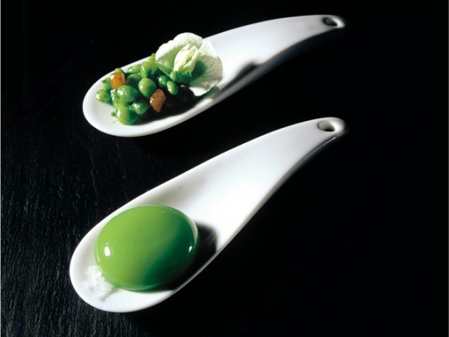 Francesc Guillamet/elBulli One of the first "spherical" dishes tried at elBulli: the large oval "raviolo" has a gelatinous shell and a liquid center, and tastes of peas; the second spoon contains a salad of fresh peas and mint oil.