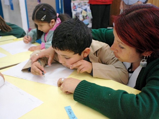 Aldo Benincasa A teacher and student work together on a writing exercise. Chilean schools typically don't begin to teach reading until the first grade; UBC gives teachers strategies for introducing the alphabet and building early literacy with four- and five-year-olds.