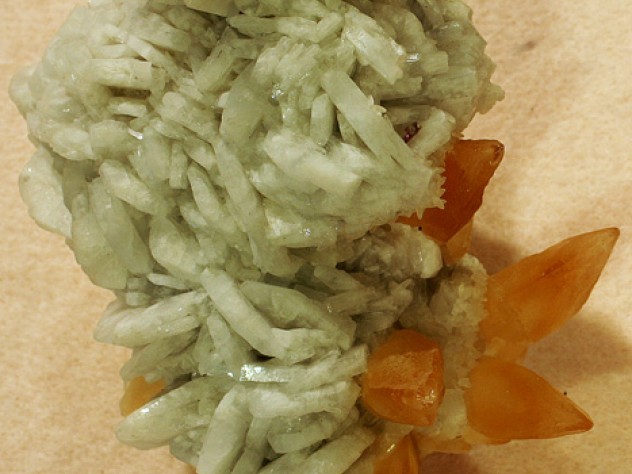 Spiky orange crystals of calcite with barite crystals, from the Minerva #1 Mine in Hardin County, Illinois 