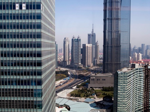 Harvard Center Shanghai is in the new office tower to the left (top); the 88-story Jin Mao Tower and 101-story World Financial Center rise to the right.