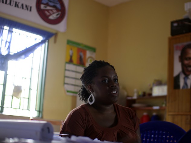 Photograph by Ian MacLellan Brooks (shown in the clinic office) wrote health lessons that take into account local cultural factors, rather than dispensing the same medical advice offered in the United States.